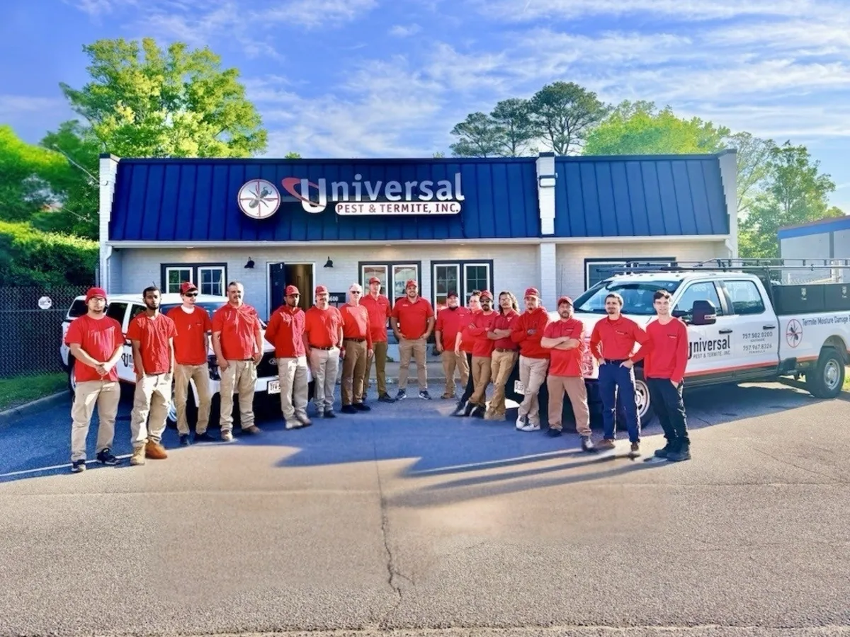 Universal technicians in red shirts gathered with their service trucks at the home office that dispatches crews to Chesapeake, VA