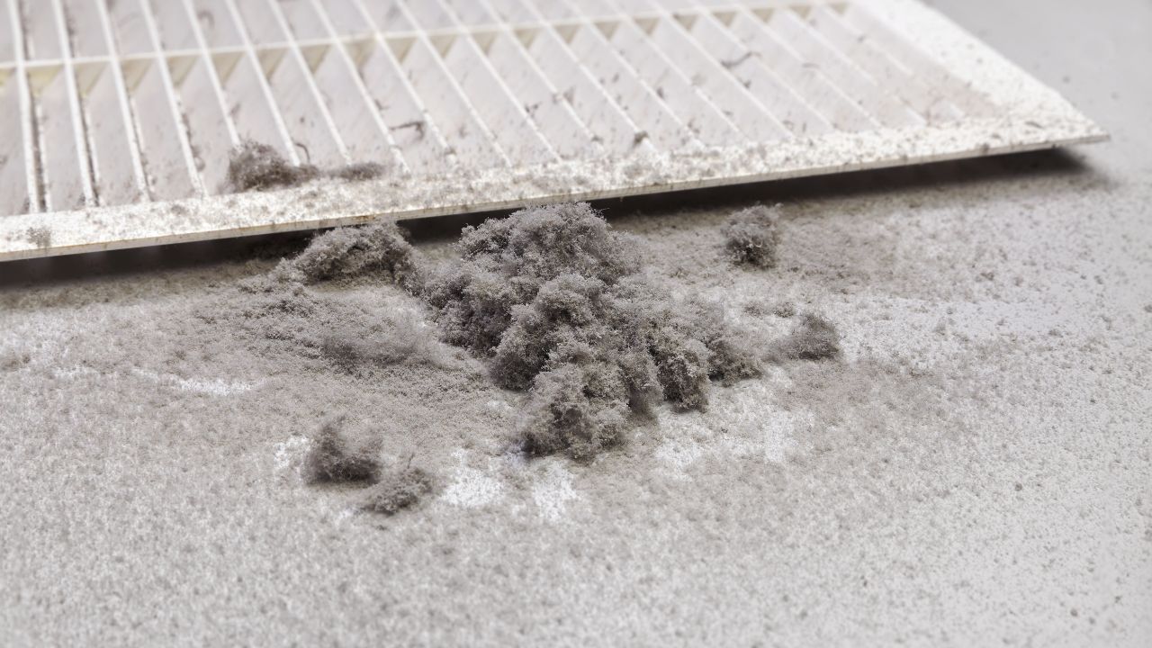 a dirty air duct vent with dirt and dusts