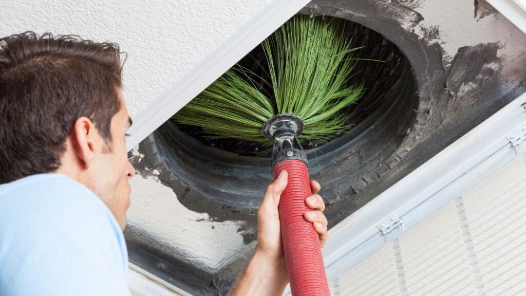 air duct specialist cleaning with brush