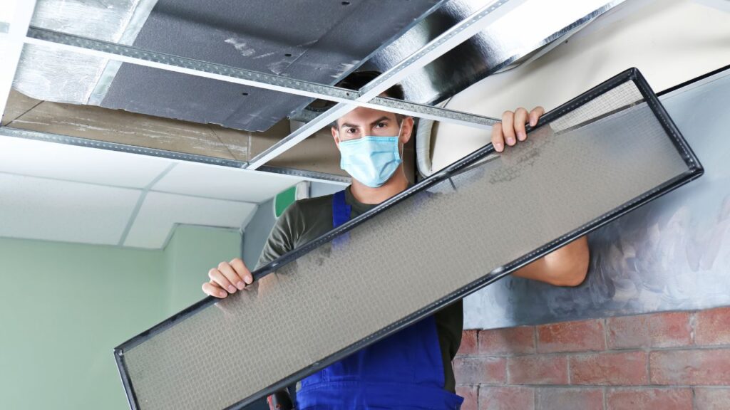 contractor disinfecting air duct